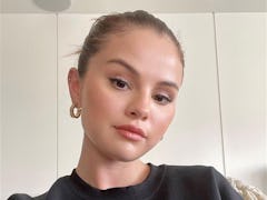 Selena Gomez shares her workout routine on Instagram along with a selfie in her Rare Beauty sweatshi...