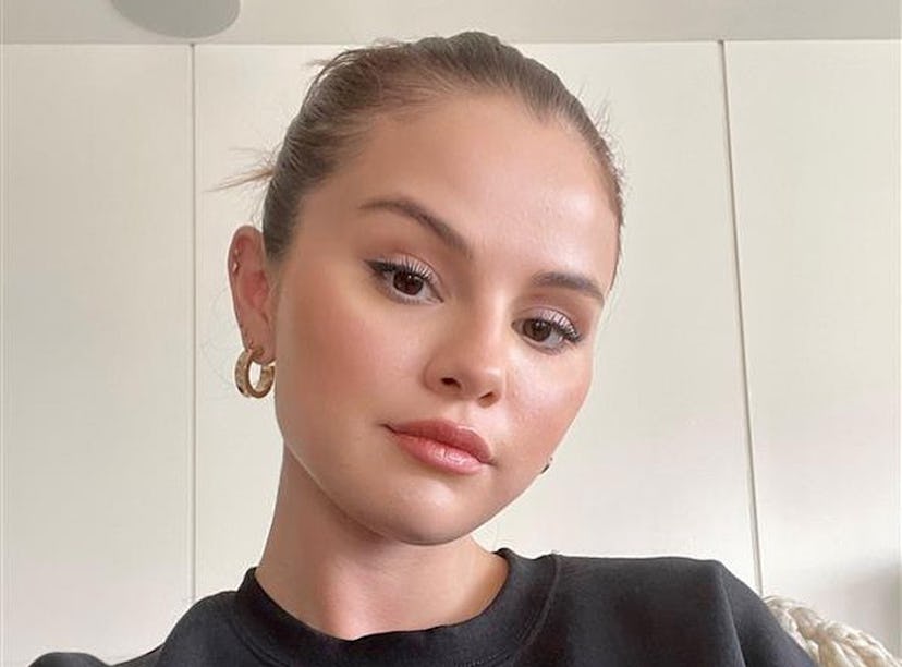 Selena Gomez shares her workout routine on Instagram along with a selfie in her Rare Beauty sweatshi...