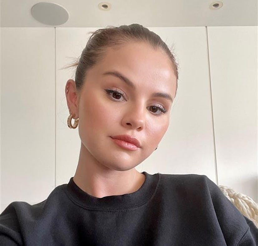Selena Gomez shares her workout routine on Instagram along with a selfie in her Rare Beauty sweatshi...
