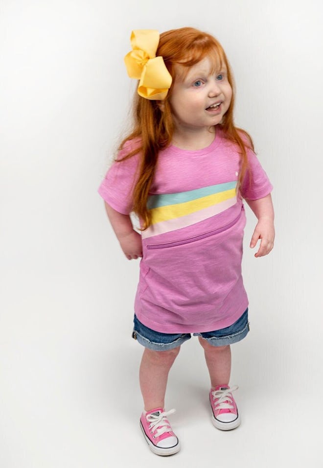 little girl wearing pink shirt that's for adaptive clothing for kids