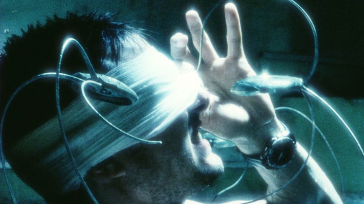 John Anderton (Tom Cruise) tries to hide his eyes from spider robots in Minority Report