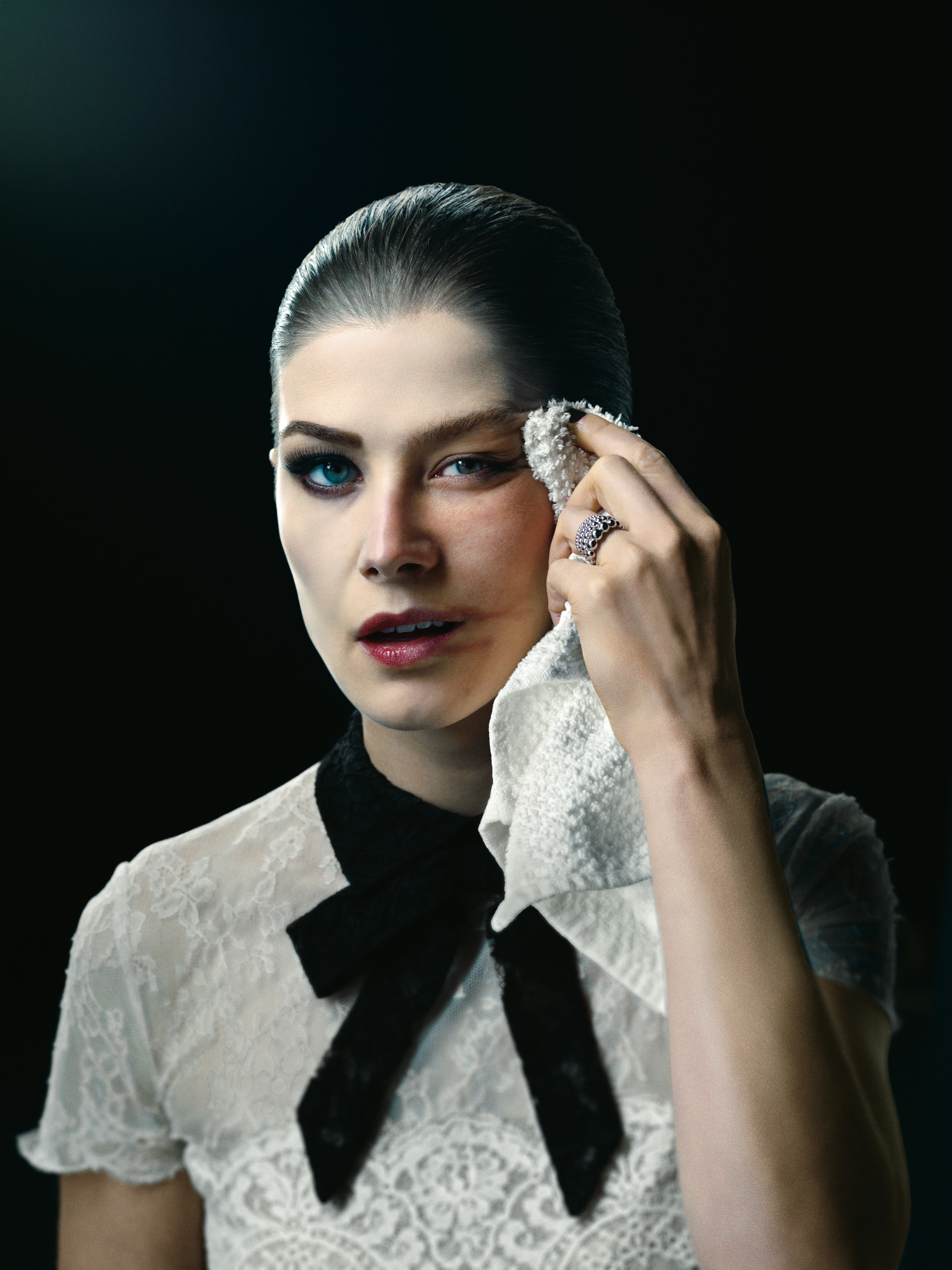 Rosamund Pike wiping makeup off of her face