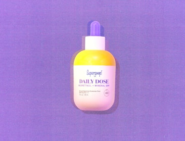 A photo of Supergoop's new SPF. It comes in a yellow bottle with a pipet top.