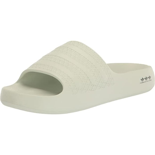 a pair of sporty-chic adidas adilette slide sandals