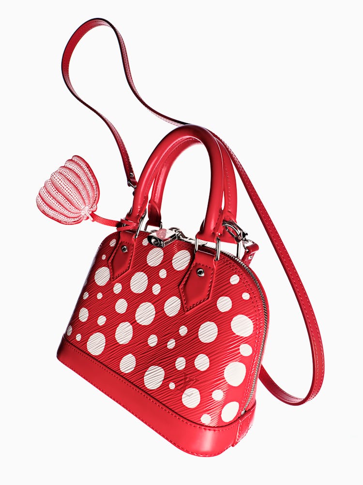 a red and white polka dot bag from louis vuitton x yayoi kusama