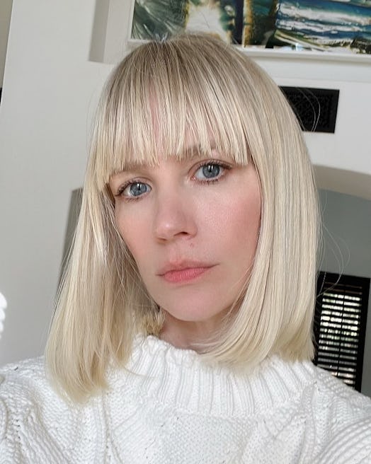 January Jones bob with bangs cleopatra haircut in platinum baby blonde selfie 2022