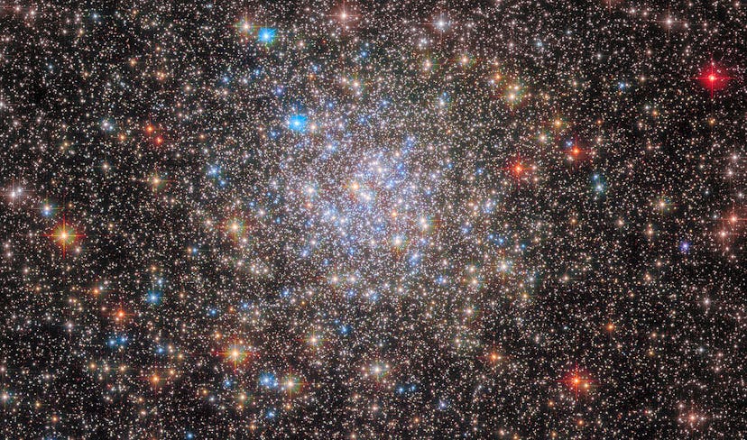 The scattered stars of the globular cluster NGC 6355 are strewn across this image from the NASA/ESA ...