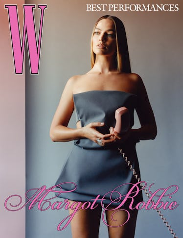 Robbie wears a Prada dress; Pasquale Bruni ring.