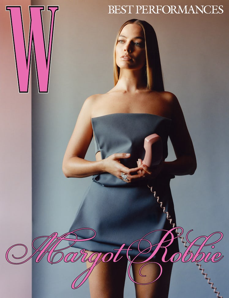 Robbie wears a Prada dress; Pasquale Bruni ring.