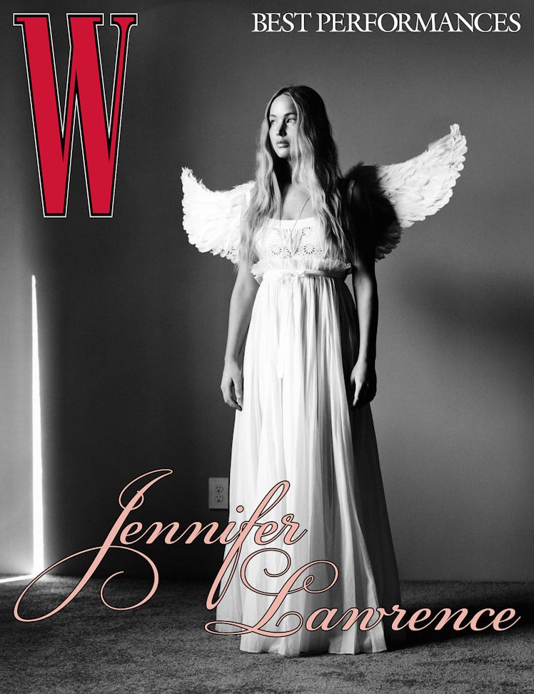 Jennifer Lawrence wearing a long white dress and angel wings