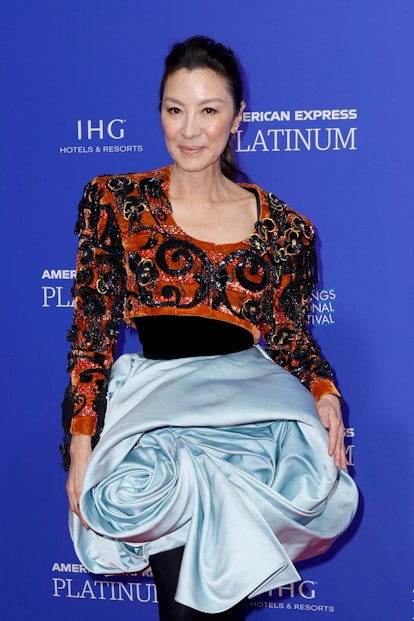 Michelle Yeoh wearing a sculptural dress and jacket combo at the Palm Springs International Film Fes...