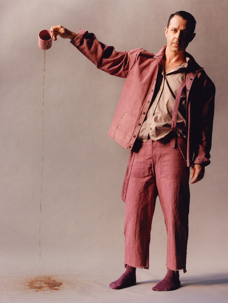 Strong wears an Anecho jacket, shirt, and jeans; Falke socks.