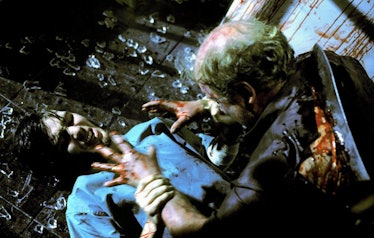 Cillian Murphy fighting a zombie in 28 Days Later.