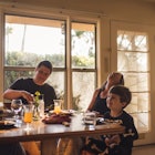 A family of four eating breakfast.