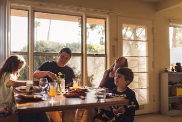 A family of four eating breakfast.