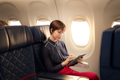 A woman doesn't have to worry about how to get free WiFi on the plane and enjoys free WiFi on Delta ...