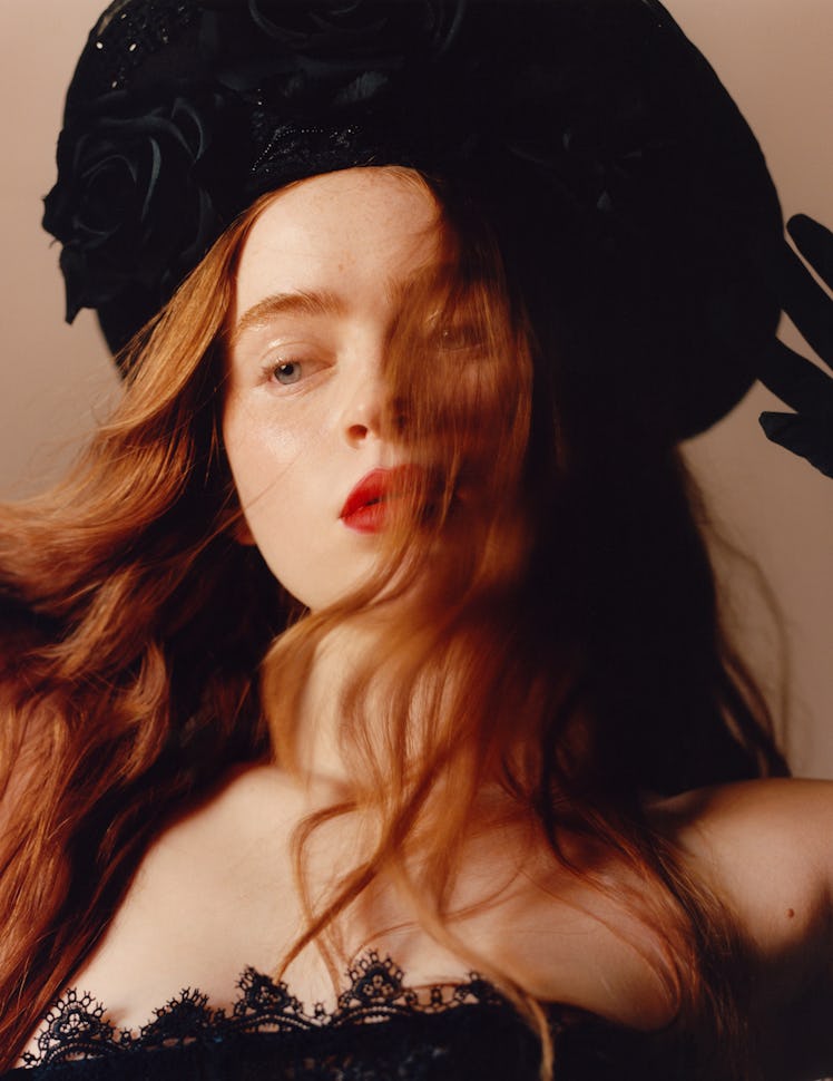 Sink wears a Dior dress; Heather Huey headpiece; stylist’s own gloves.