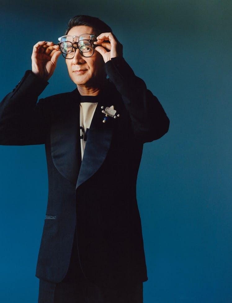 Ke Huy Quan wears a Wales Bonner suit and T-shirt; glasses, from top: Tom Ford, Oliver Peoples, his ...