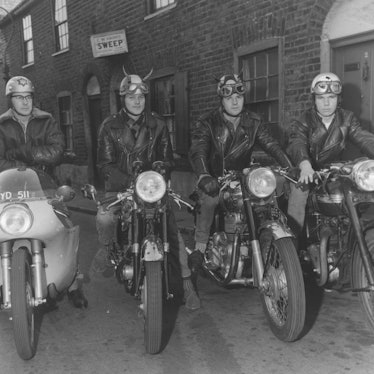 Rockers with unusual helmets sit proudly on their loaded cafe racers.  The bikes are (from the second ...