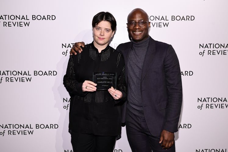 Charlotte Wells accepts the Best Directorial Debut award for “Aftersun” from Barry Jenkins during th...