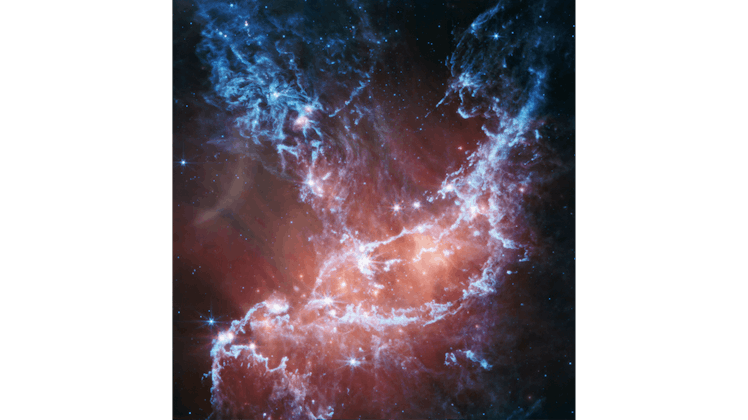 image of filaments of gas and dust, dotted with bright stars, in space