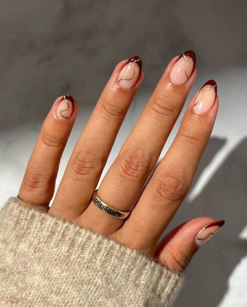 If you need manicure inspo, dark red French tips a simple design for short nails that's on-trend for...