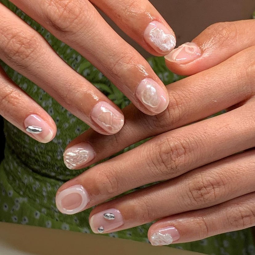 If you need manicure inspo, here is a simple neutral nail design for short nails that's on-trend for...