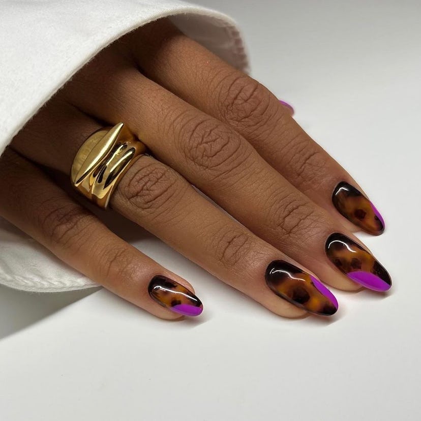 If you need manicure inspo, tortoiseshell nails offer a simple design for short nails that's on-tren...