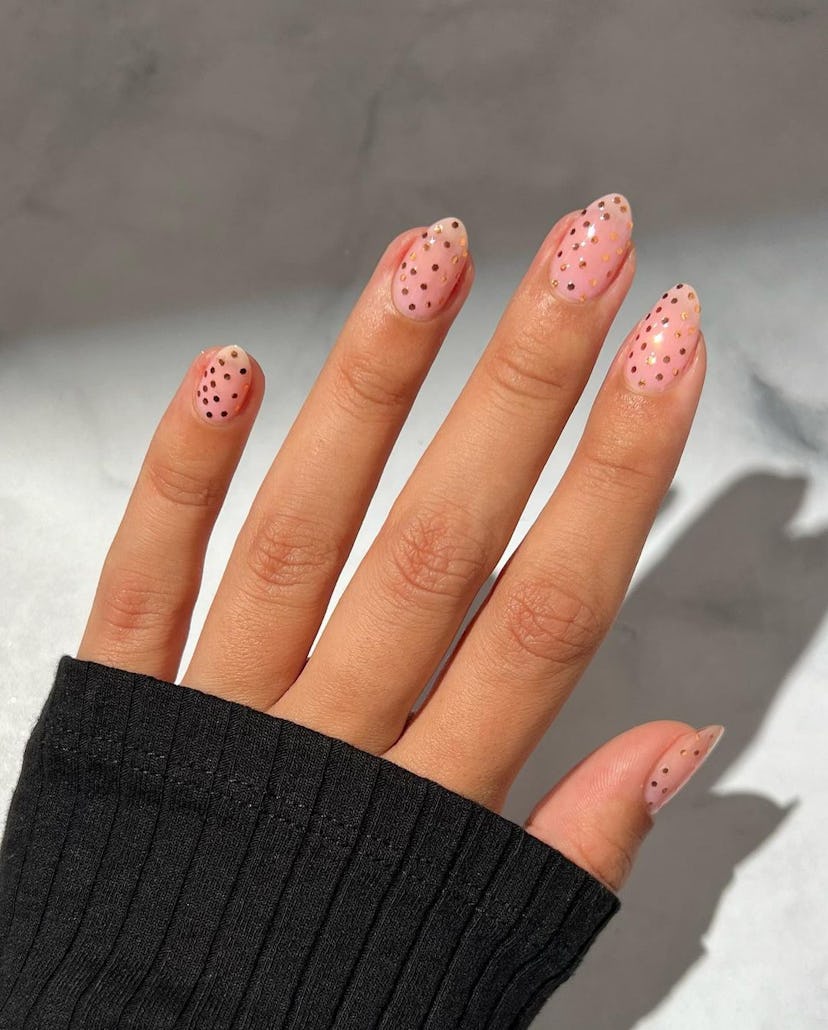 If you need manicure inspo, gold polka dot nail art is an easy nail design for short nails that's po...