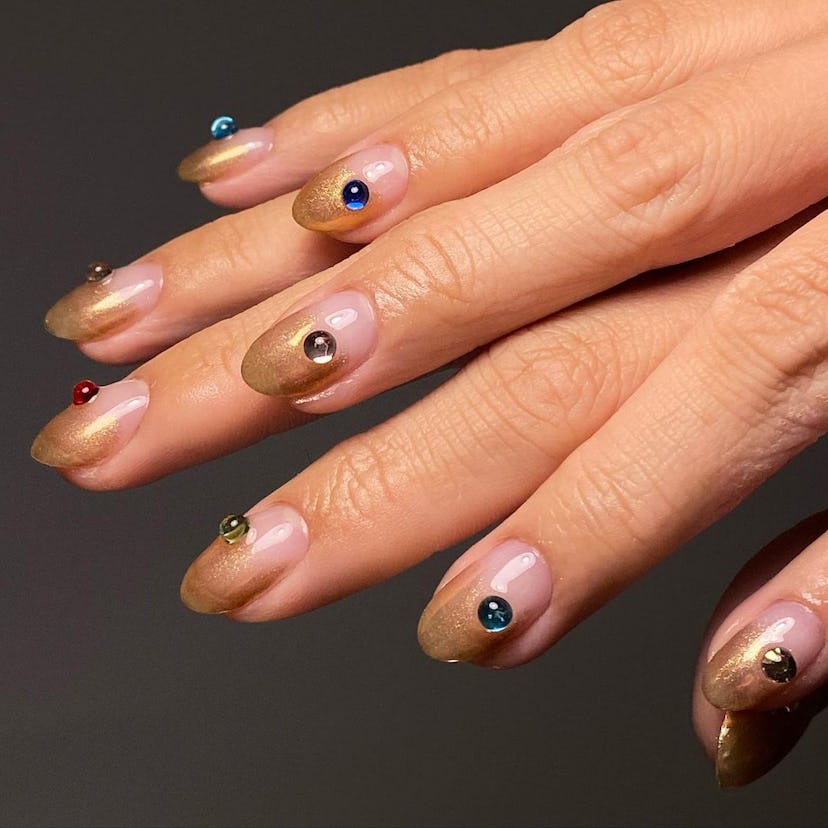 If you need manicure inspo, a simple gold gradient nail design for short nails is on-trend for fall/...