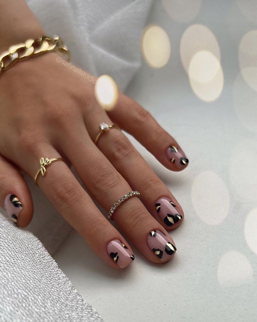 If you need manicure inspo, abstract leopard print nail art is a simple design for short nails that'...