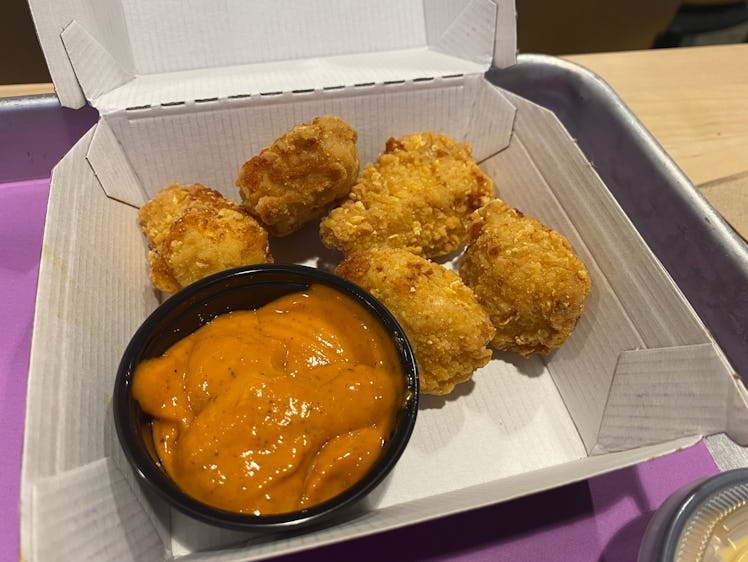 I tried Taco Bell's new menu item, Crispy Chicken Nuggets, with both their signature Bell Sauce and ...