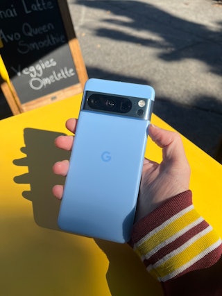 Google Pixel 8 smartphone in a hand.