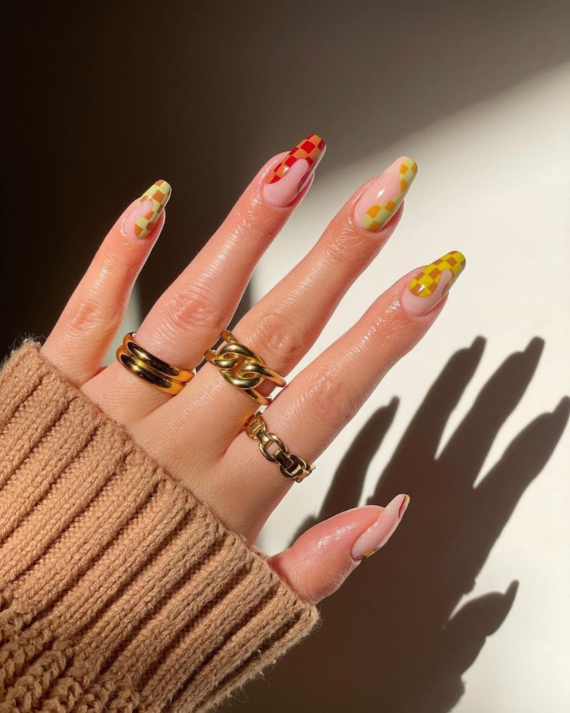 A trendy checkered nail design for 2023.