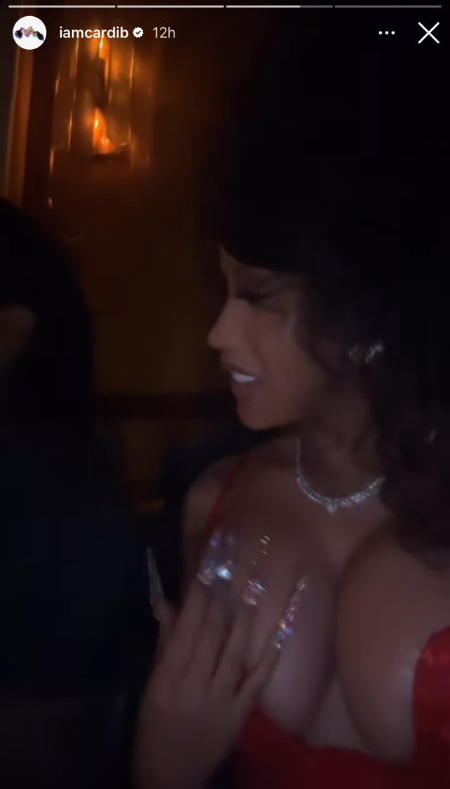 Cardi B celebrated her 31st birthday with a big curly updo and long bedazzled acrylic nails.