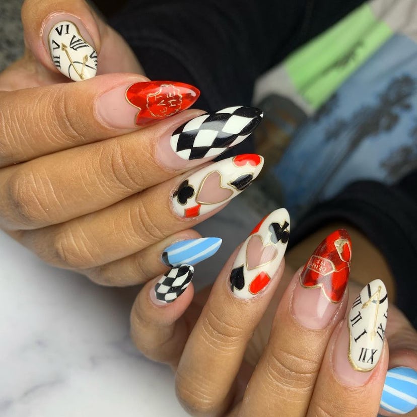 'Alice in Wonderland' nail art that combines checkered nails, hears, clubs, spades, and clock nail d...
