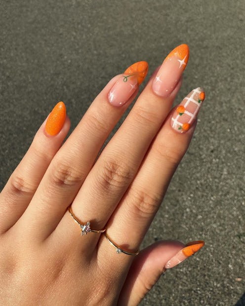 Here are orange-filled pumpkin nail art design ideas for fall 2023.