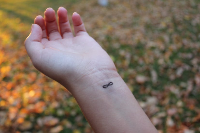 Infinity symbol tattoo on wrist, in a story about tattoos tattoo artists are tired of doing.