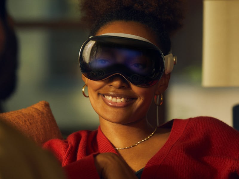 A person wearing Apple Vision Pro with their eyes showing via the EyeSight feature