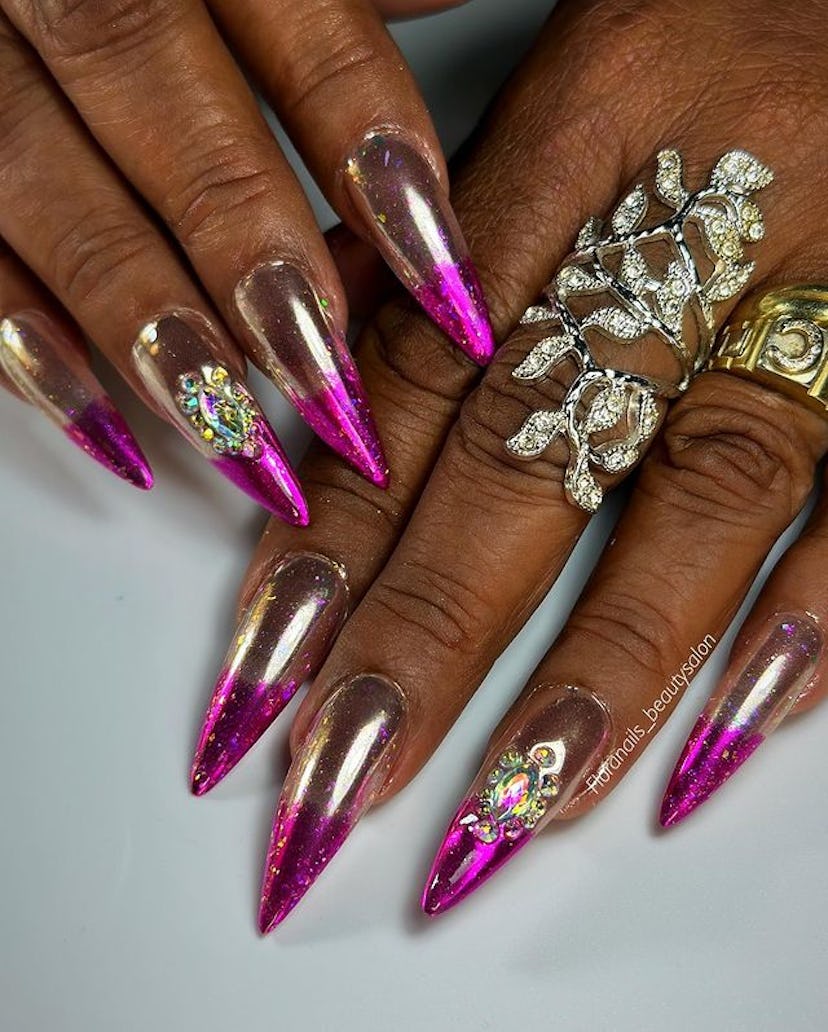 Pink and rose gold bejeweled chrome nails.