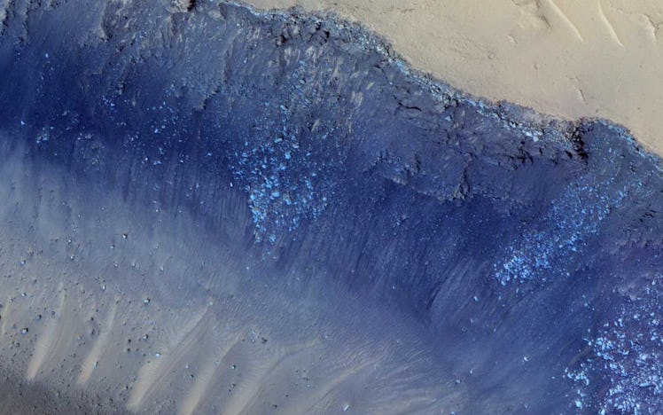 A stark ridge on Mars' surface is colored so that its features and depth pop out in this birds-eye v...
