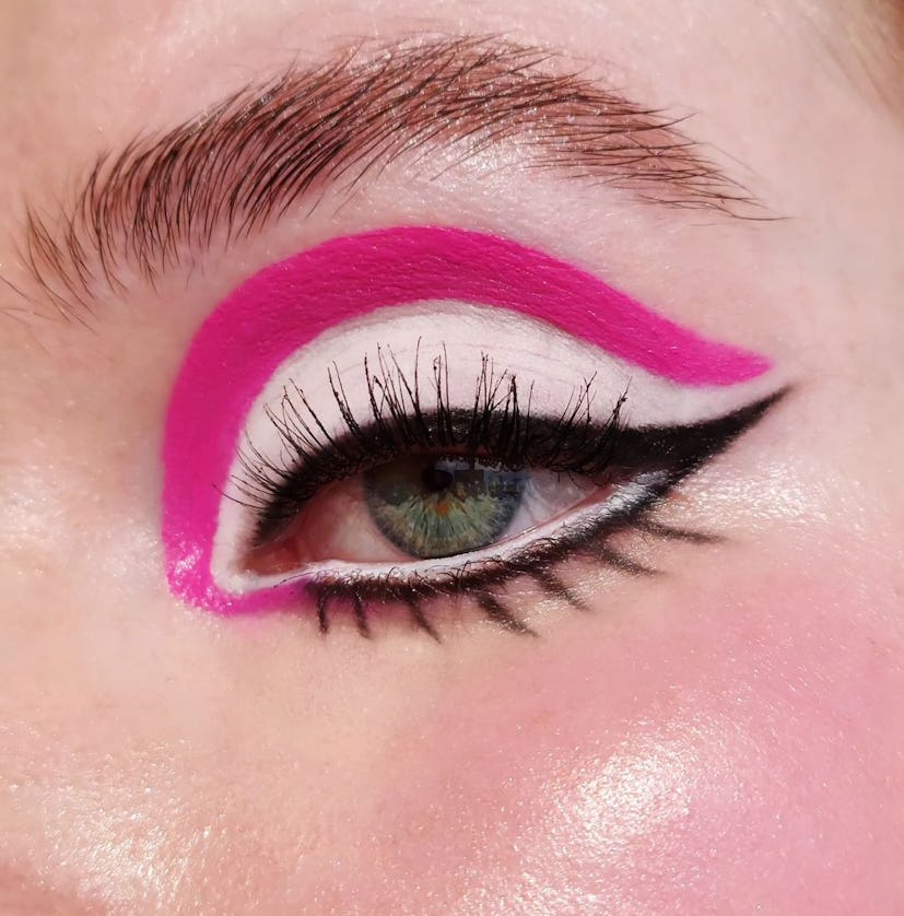 A Barbie makeup idea for Halloween 2023, graphic pink eyeliner will go perfectly with a doll costume...