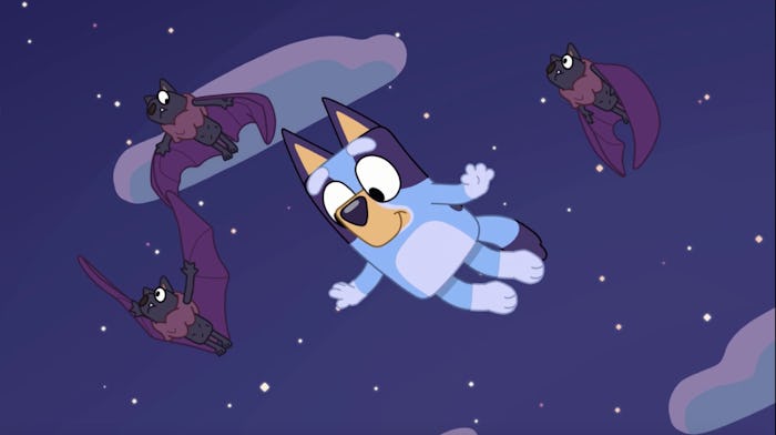 Bluey flies in the night sky with bats in the episode 'Fruit Bat.'