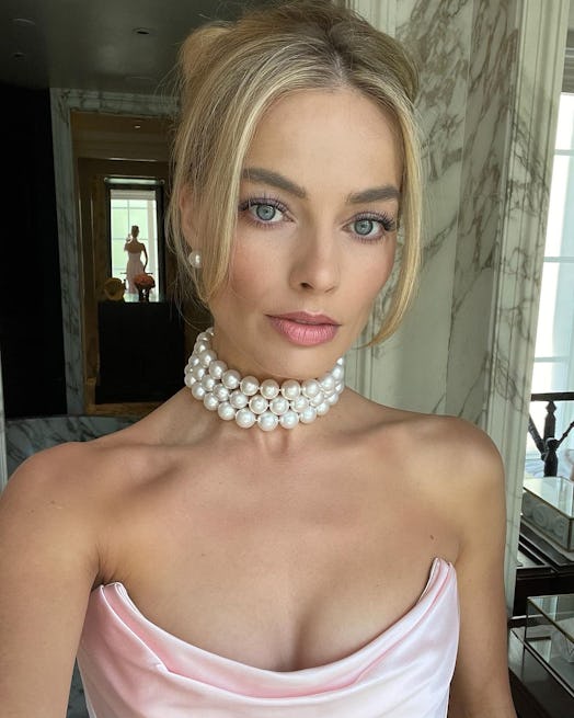 Use Margot Robbie's soft pink 'Barbie' makeup as inspiration for Halloween 2023.