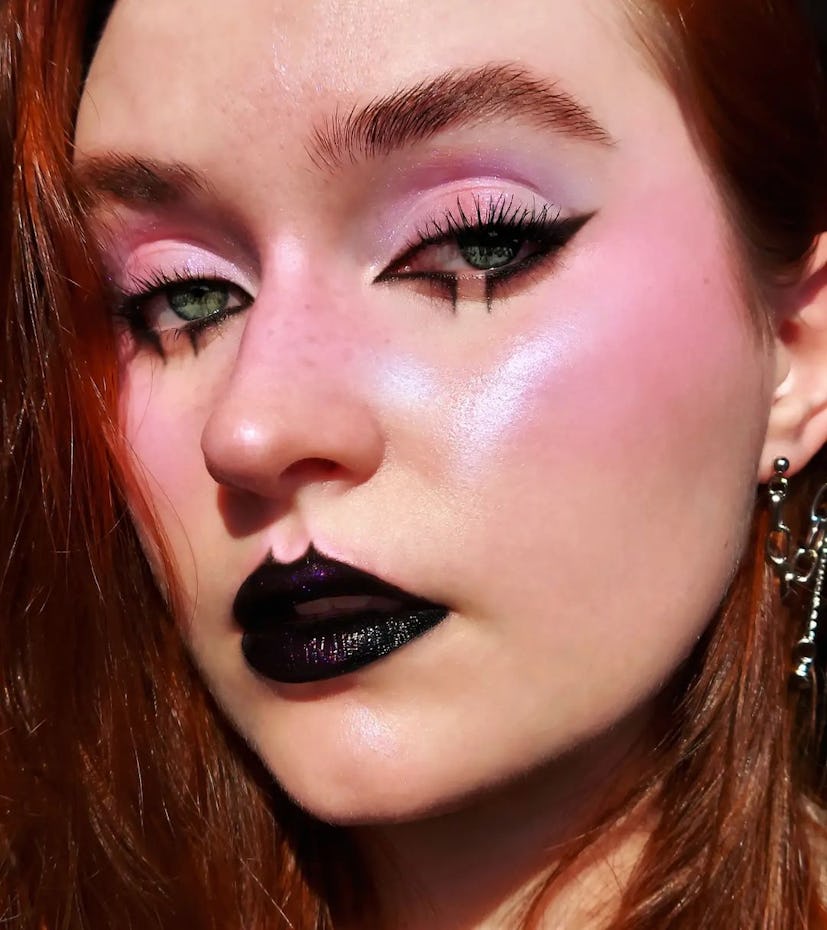 If you need a creative Barbie makeup idea for Halloween 2023, try a goth Barbie look with black lips...