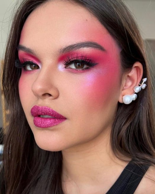 If you need a Barbie makeup idea for Halloween 2023, combine hot pink blush, metallic lipstick, & fu...