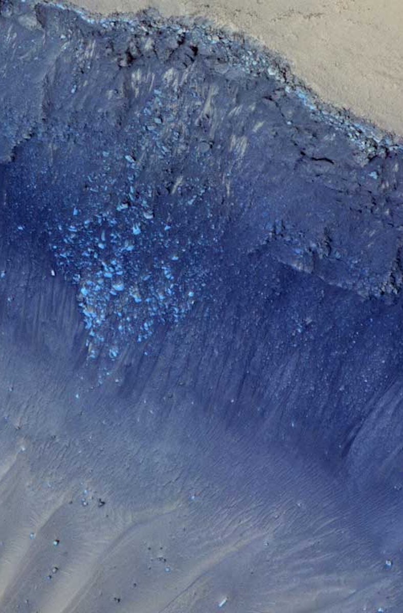 A stark ridge on Mars' surface is colored so that its features and depth pop out in this birds-eye v...