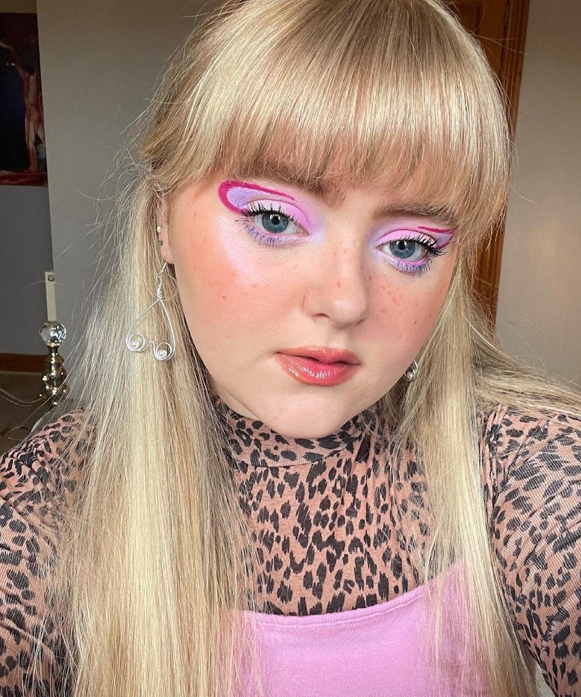 Hot pink graphic eyeliner is a creative Barbie makeup idea for Halloween 2023.