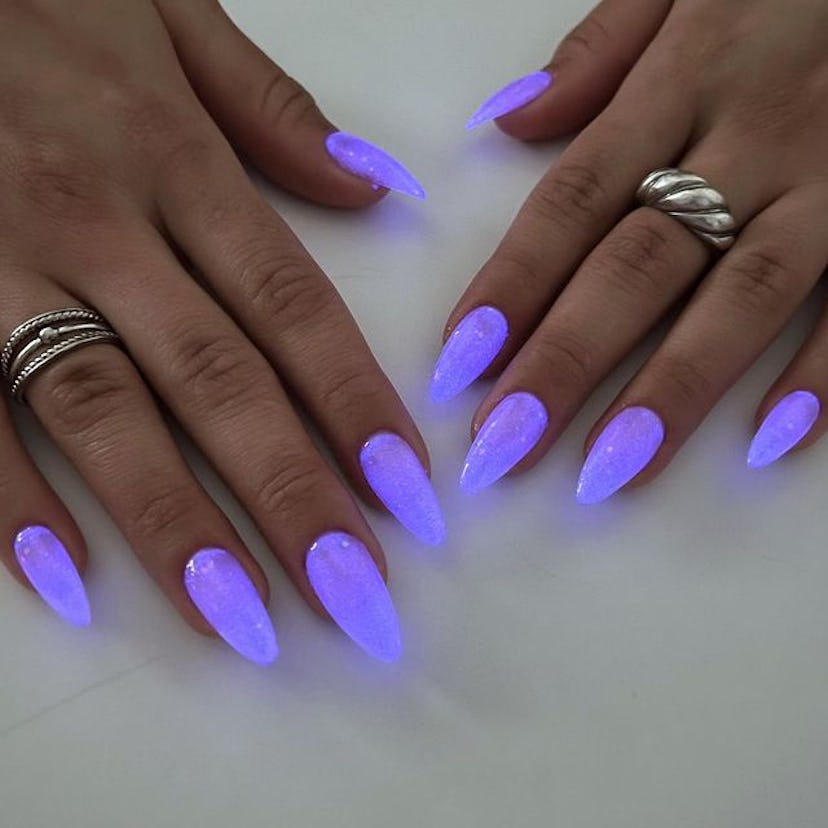 Purple glow-in-the-dark nails.