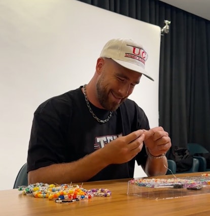 Travis Kelce making friendship bracelets